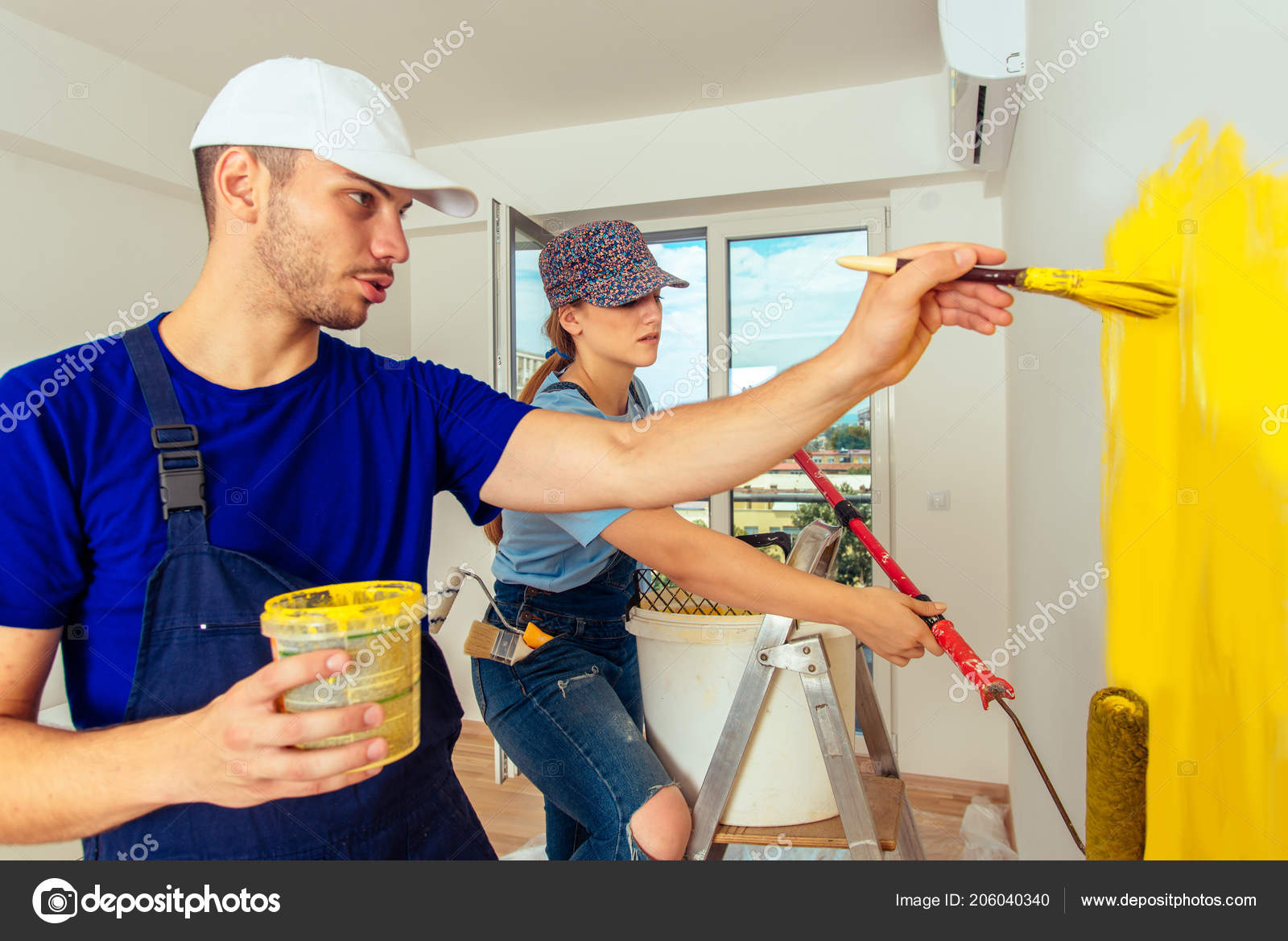 Male Female Paint Stick Roller Paintbrush Coloring Room Yellow Stock Photo  by ©gorgev 206040340